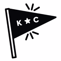 Small triangle flag that reads "K*C"